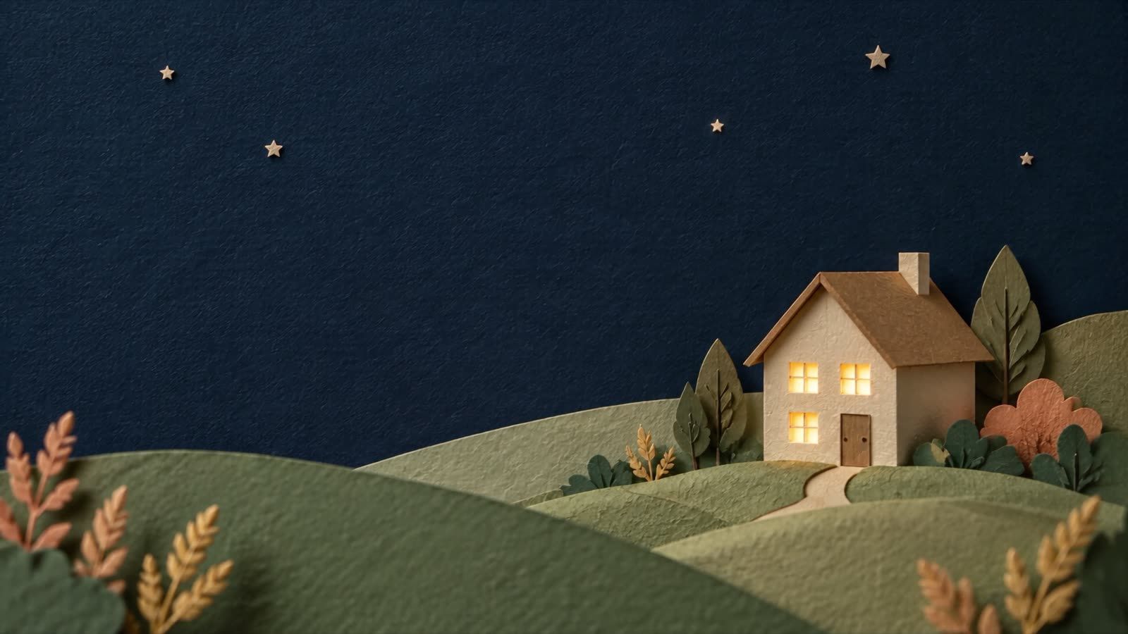A paper-craft house with glowing windows on rolling green paper hills under a navy paper sky.